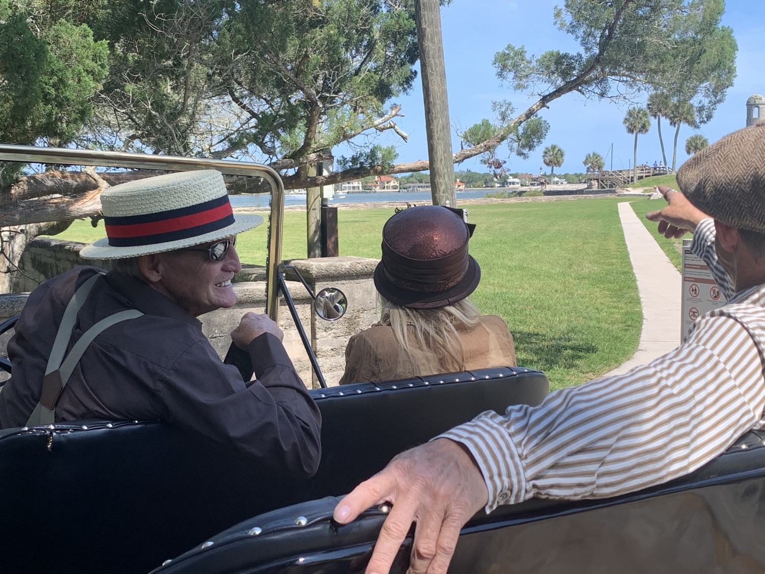A Pastime Tours guide pointing out a St. Augustine landmark to guests
